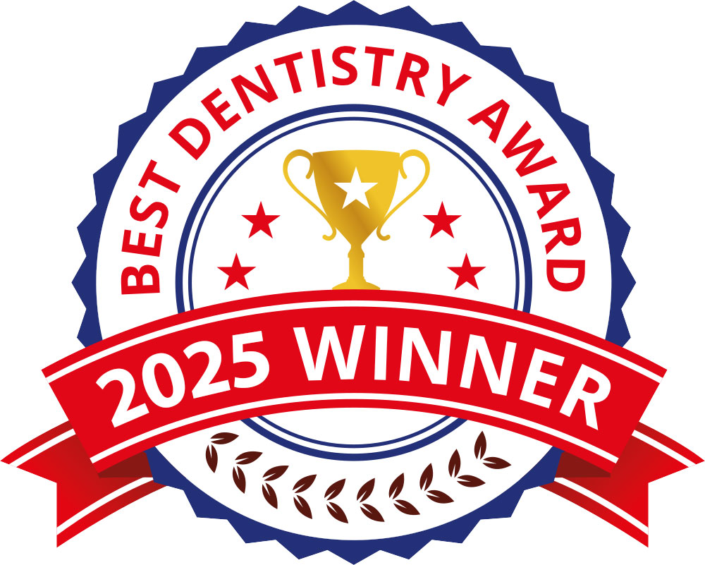 The image displays a badge with a red seal in the center, featuring text and symbols. It reads Best Dentistry 2023 at the top, followed by a gold trophy graphic. Below this, there s a ribbon that says Winner with a banner underneath stating 2025 Winner. The badge also includes a red shield-like emblem with text inside it, but the specific details of the text are not clear. The background is white, and the overall style of the image suggests an award or recognition emblem.